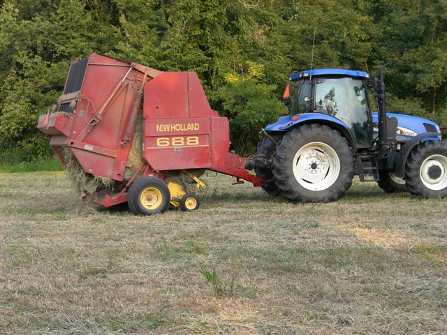 Description: Description: Description: Description: Description: Description: Description: Description: Description: Description: New Holland 688 Hay Bailer Ejecting a Bail